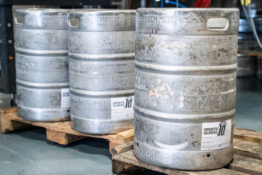 Three beer kegs on pallets