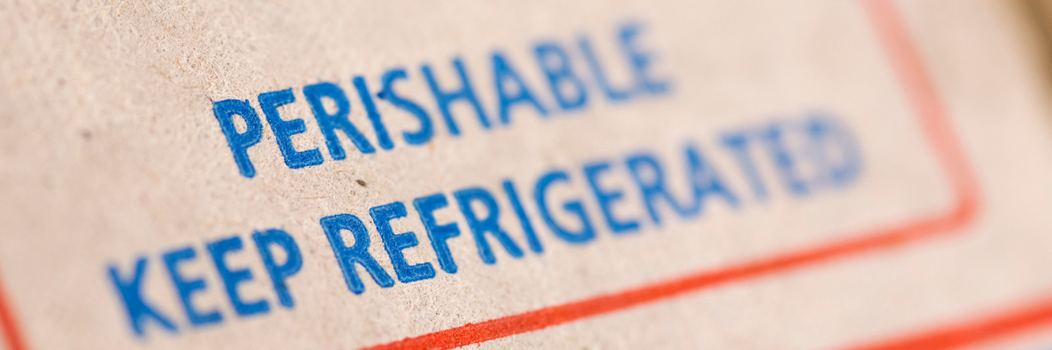 A closeup of a box with the words “perishable, keep refrigerated” written on it.