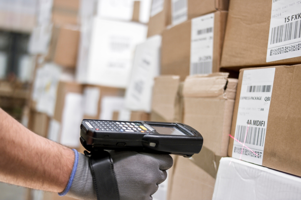  a man using an RFID handheld reader
