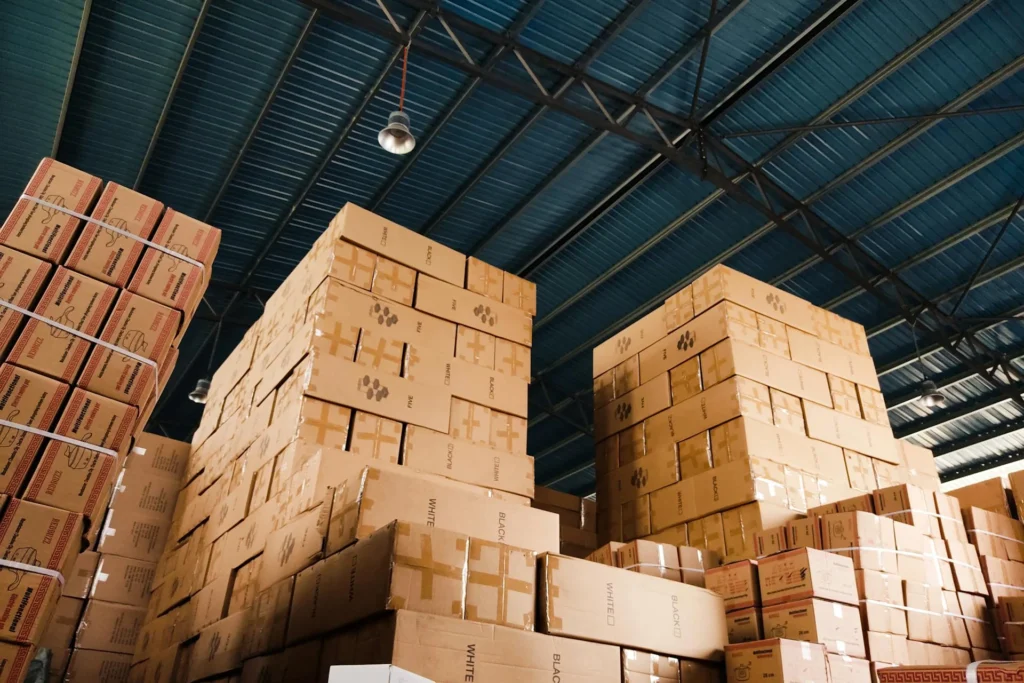 A warehouse filled with small packages stacked on pallets