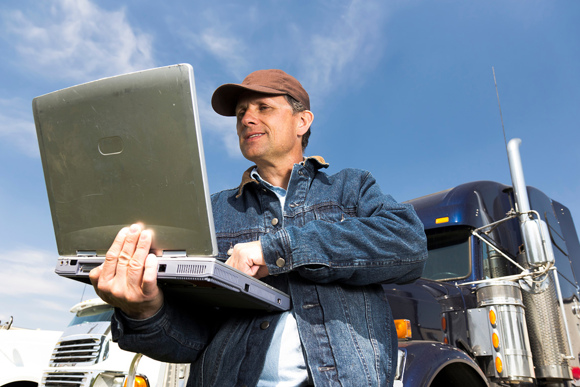 The right freight broker using a transportation management system on a laptop