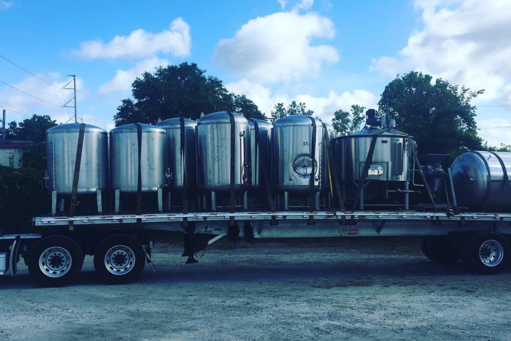 a truck transporting multiple tanks of liquid