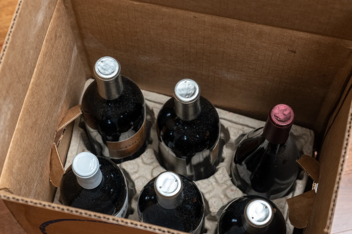 six wine bottles in a box